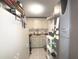 Utility storage area features ample cabinet space, shelving and a utility closet in the background at 100 Bluff View Dr # 401A, Belleair Bluffs, FL 33770