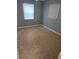 A bedroom with tile floors and two windows at 1001 E 26Th Ave, Tampa, FL 33605