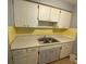 Kitchen with white cabinets and double sink at 1001 E 26Th Ave, Tampa, FL 33605