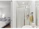 Ensuite bathroom featuring a clear glass enclosed shower with tile surround at 10144 Arbor Run Dr # 107, Tampa, FL 33647