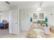 Bathroom boasts granite counters, a vanity area, and entryways to the bedroom and toilet at 10144 Arbor Run Dr # 107, Tampa, FL 33647