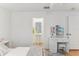 Bright, airy bedroom features a vanity with abundant storage and ensuite bathroom at 10144 Arbor Run Dr # 107, Tampa, FL 33647