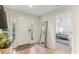 Inviting foyer with natural light from the front door's side windows and view to bedroom at 10144 Arbor Run Dr # 107, Tampa, FL 33647
