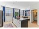 Kitchen featuring a large island, stainless steel appliances, modern lighting, and an open layout at 10144 Arbor Run Dr # 107, Tampa, FL 33647