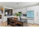 Modern kitchen featuring an island, stainless steel appliances, and sleek countertops at 10144 Arbor Run Dr # 107, Tampa, FL 33647