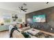 Bright living room with large windows, stylish sofa, modern wall art, and contemporary decor at 10144 Arbor Run Dr # 107, Tampa, FL 33647