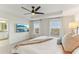 The bright bedroom features a ceiling fan and large windows, providing natural light to the space at 10144 Arbor Run Dr # 107, Tampa, FL 33647