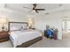 Spacious main bedroom with ample natural light, ceiling fan, and coordinated furniture at 10144 Arbor Run Dr # 107, Tampa, FL 33647