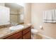 Clean bathroom with granite countertop, tiled shower, and updated fixtures at 10428 Rivercrest Dr, Riverview, FL 33578