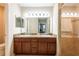 Double vanity bathroom with granite countertop and shower at 10428 Rivercrest Dr, Riverview, FL 33578