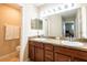 Double vanity bathroom with granite countertop and shower at 10428 Rivercrest Dr, Riverview, FL 33578