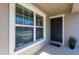 Front door entry with a double window and a welcome mat at 10428 Rivercrest Dr, Riverview, FL 33578
