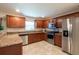 Modern kitchen featuring stainless steel appliances and granite countertops at 10428 Rivercrest Dr, Riverview, FL 33578