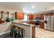 Modern kitchen with stainless steel appliances and wood cabinets at 10428 Rivercrest Dr, Riverview, FL 33578