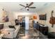 Open living room with dark marble floors and a comfy sofa at 10428 Rivercrest Dr, Riverview, FL 33578