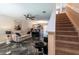 Living room with marble floors, staircase, and a ceiling fan at 10428 Rivercrest Dr, Riverview, FL 33578