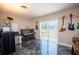 Music room with sliding glass door, piano, and guitars at 10428 Rivercrest Dr, Riverview, FL 33578
