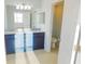 Bathroom with double vanity and adjacent toilet at 11016 Holly Cone Dr, Riverview, FL 33569