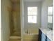 Bathroom with shower, bathtub, and granite countertop at 11016 Holly Cone Dr, Riverview, FL 33569