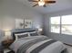 Main bedroom with large window and stylish decor at 11016 Holly Cone Dr, Riverview, FL 33569
