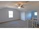 Spacious bonus room with carpet flooring and natural light at 11016 Holly Cone Dr, Riverview, FL 33569