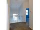 Upstairs hallway with carpet and wrought iron railing at 11016 Holly Cone Dr, Riverview, FL 33569