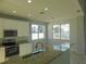 Kitchen boasts granite countertops and white cabinets at 11016 Holly Cone Dr, Riverview, FL 33569
