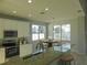 Kitchen with white cabinets, granite counters and stainless steel appliances at 11016 Holly Cone Dr, Riverview, FL 33569