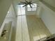 High-ceilinged living area with tile floors and pool access at 11016 Holly Cone Dr, Riverview, FL 33569