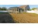 House with a screened-in pool and fenced backyard at 11016 Holly Cone Dr, Riverview, FL 33569