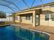 Screened-in pool, extended patio, and house exterior at 11016 Holly Cone Dr, Riverview, FL 33569