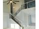 Elegant staircase with wrought iron railings at 11016 Holly Cone Dr, Riverview, FL 33569