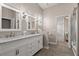 Elegant bathroom with double vanity and marble countertops at 1257 Kings Way Ln, Tarpon Springs, FL 34688