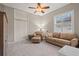 Spacious bedroom with a sitting area and large closet at 1257 Kings Way Ln, Tarpon Springs, FL 34688