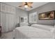 Twins bedroom with large closet and ceiling fan at 1257 Kings Way Ln, Tarpon Springs, FL 34688