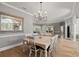 Elegant dining room with chandelier and hardwood floors at 1257 Kings Way Ln, Tarpon Springs, FL 34688