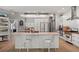 Spacious kitchen with white cabinets, granite countertops and island at 1257 Kings Way Ln, Tarpon Springs, FL 34688