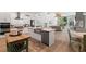 Open concept kitchen with island, stainless steel appliances, and views to Gathering room at 1257 Kings Way Ln, Tarpon Springs, FL 34688