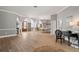 Bright living room with hardwood floors, and access to the backyard at 1257 Kings Way Ln, Tarpon Springs, FL 34688