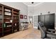 Spacious home office with hardwood floors and built-in shelving at 1257 Kings Way Ln, Tarpon Springs, FL 34688