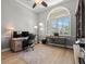 Home office with built-in shelving and hardwood floors at 1257 Kings Way Ln, Tarpon Springs, FL 34688