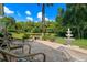 Peaceful patio with fountain view and lush landscaping at 1257 Kings Way Ln, Tarpon Springs, FL 34688