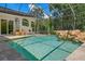 Refreshing pool with a rock waterfall feature at 1257 Kings Way Ln, Tarpon Springs, FL 34688