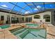 Relaxing pool and spa with a covered patio at 1257 Kings Way Ln, Tarpon Springs, FL 34688