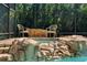 Tranquil spa nestled within a rock formation at 1257 Kings Way Ln, Tarpon Springs, FL 34688