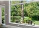 Stunning view of backyard oasis with lush landscaping and serene pond at 1257 Kings Way Ln, Tarpon Springs, FL 34688