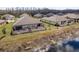 Elevated view of backyard, showing the patio and natural backdrop near the water at 13387 Crest Lake Dr, Hudson, FL 34669