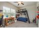This bedroom features a bunk bed, toys, and a window at 13387 Crest Lake Dr, Hudson, FL 34669
