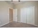 This bedroom features a closet and neutral carpet at 13387 Crest Lake Dr, Hudson, FL 34669