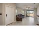 Open living room featuring tile floors, neutral walls, a ceiling fan and sliding glass doors to the lanai at 13387 Crest Lake Dr, Hudson, FL 34669